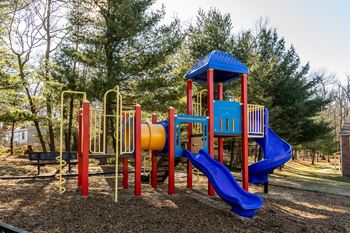 a colorful playground in a park at Spring Hill Apartments & Townhomes, Baltimore
